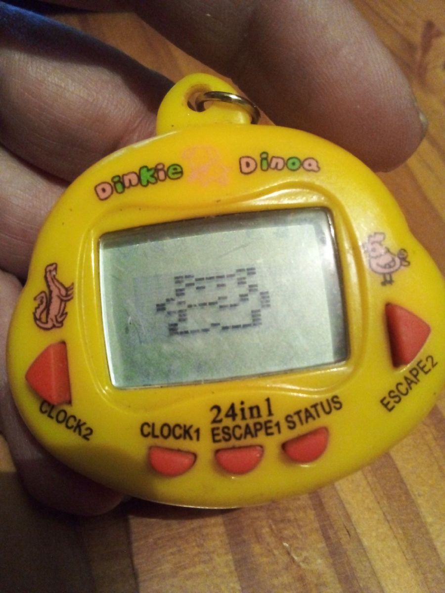 Tamagotchi Dinkie Dino – Jaune – Jeu électronique Portable – Collectionneur