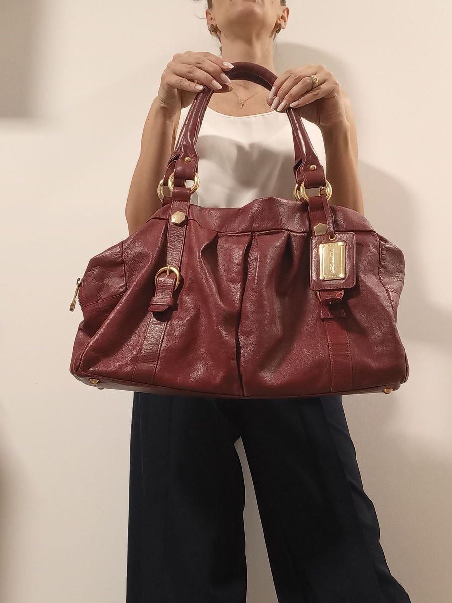 Louis Vuitton - Bolsa de viagem, em couro. Medindo: 31