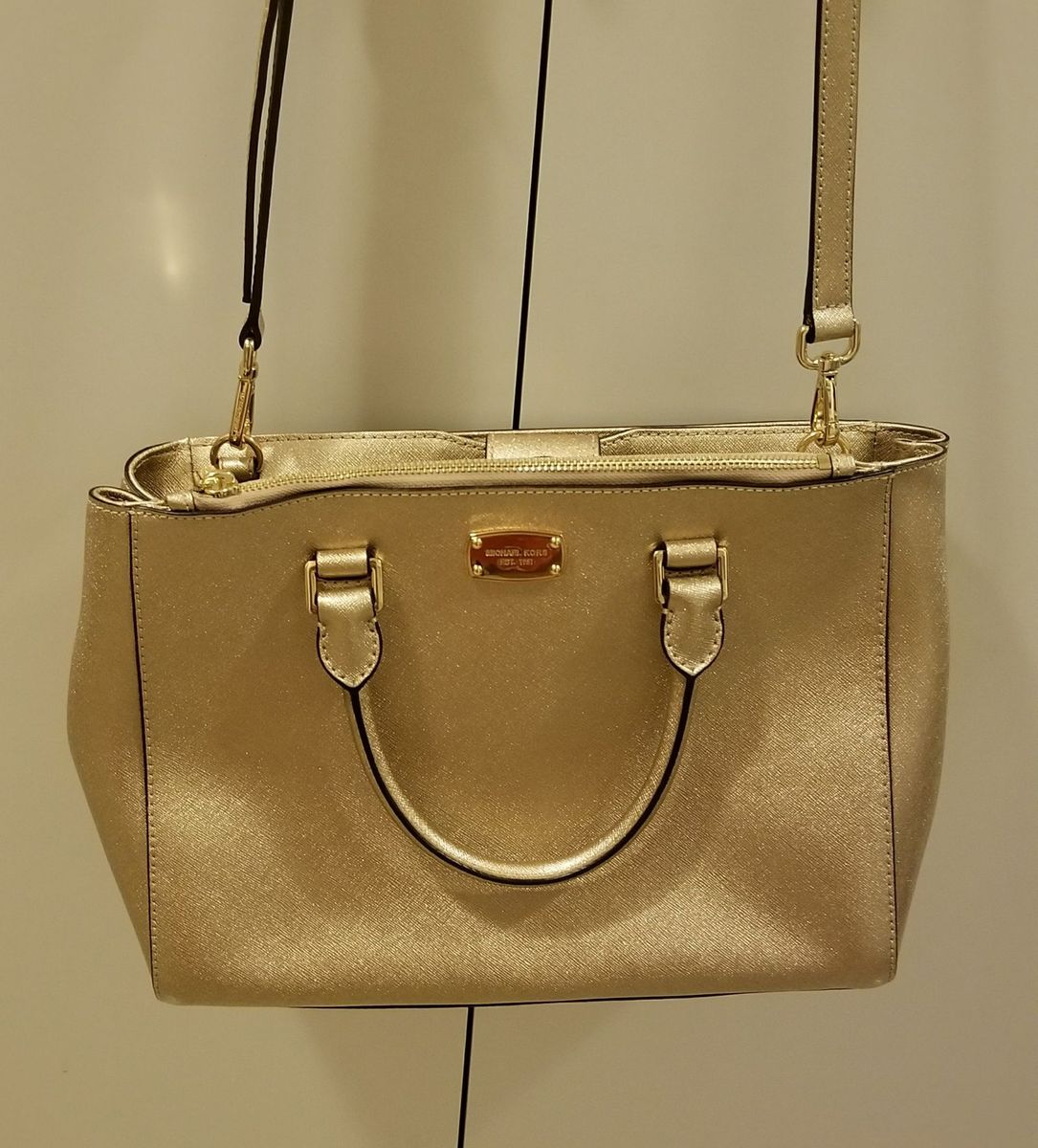 bolsa michael kors dourada original preço