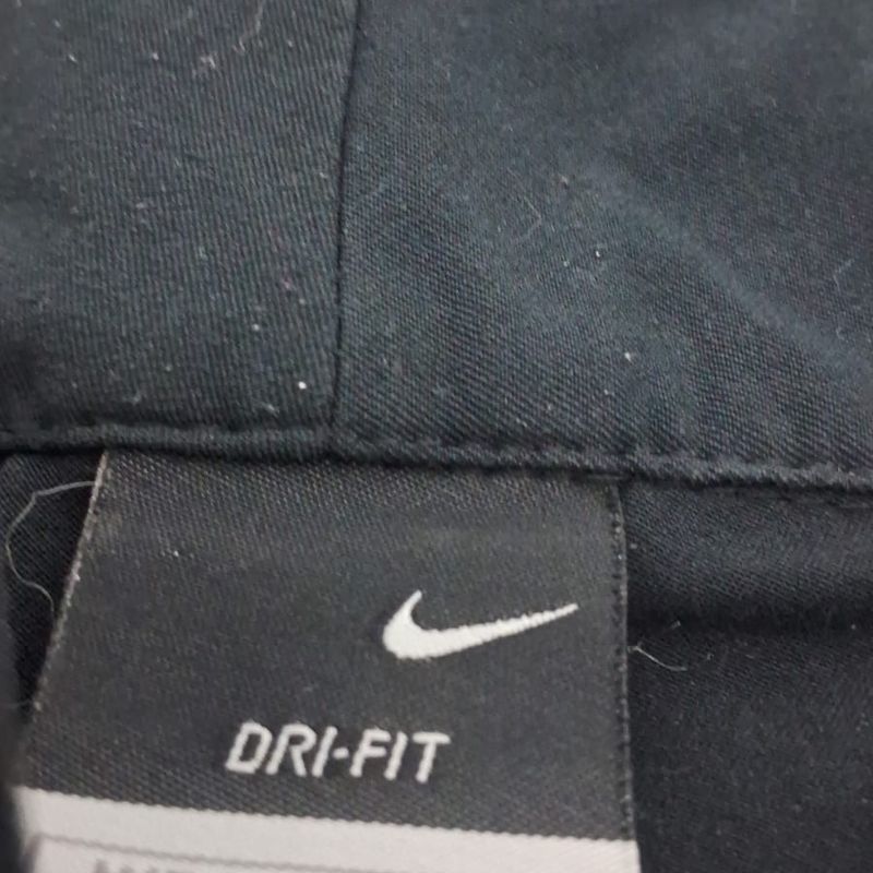 Calça best sale nike larga