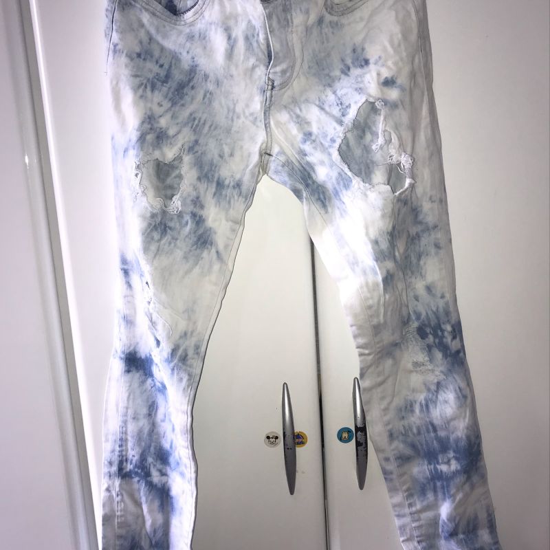 Calça jeans hot sale manchada