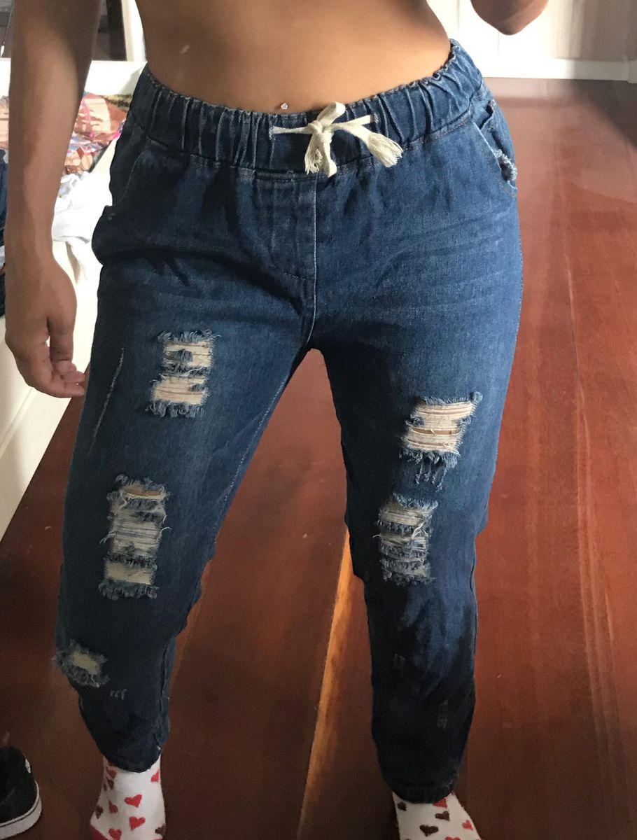 calça jogger jeans rasgada