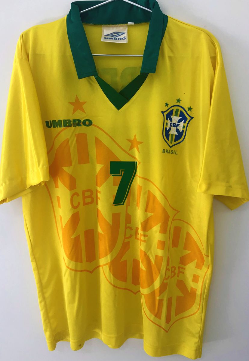 https://photos.enjoei.com.br/camisa-brasil-copa-do-mundo-1994-bebeto-7-autografada/1200xN/czM6Ly9waG90b3MuZW5qb2VpLmNvbS5ici9wcm9kdWN0cy8xMTYwNDk3NS9kODY1YTViNzgwODg4OGM1OWI0MDg1ZTBjZjA4NTgwYy5qcGc