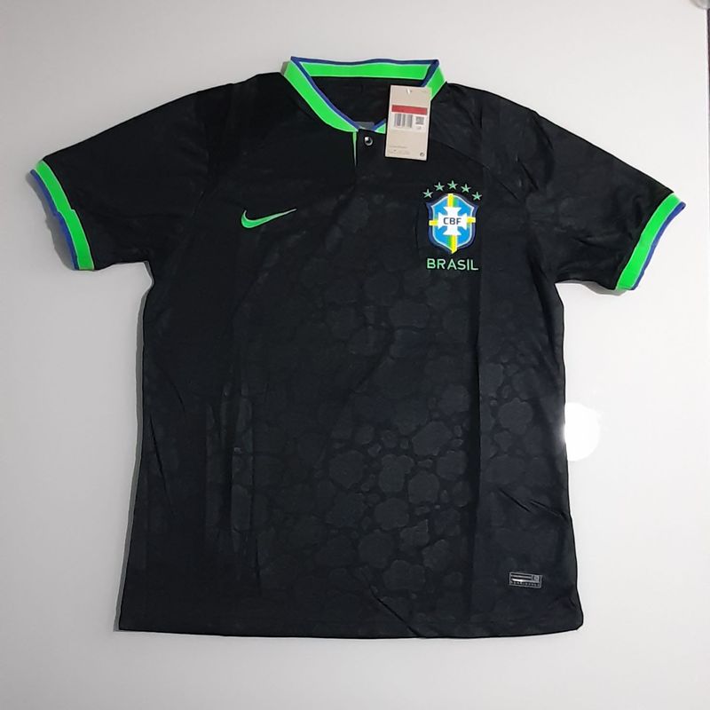 https://photos.enjoei.com.br/camisa-brasil-preta-95415256/800x800/czM6Ly9waG90b3MuZW5qb2VpLmNvbS5ici9wcm9kdWN0cy8zNDc4MzAyNS9lZTgyNTc3YWRkM2M5OTNkZjI3ZGUxOTlmYjFhMmNmMi5qcGc