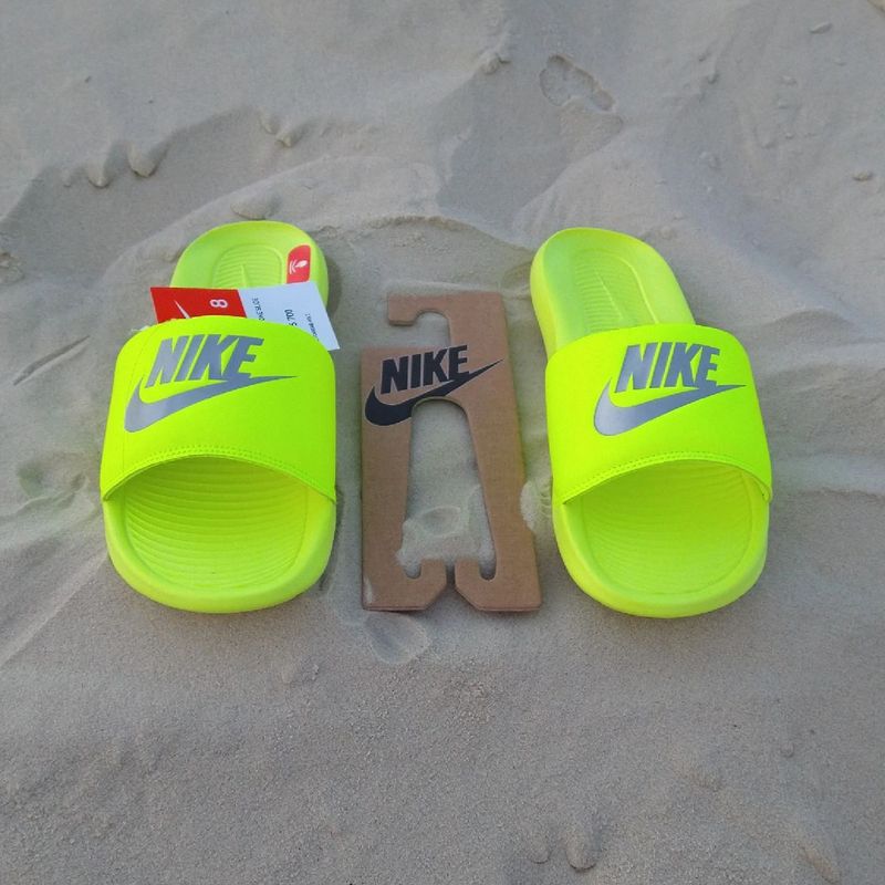 Nike store slippers neon