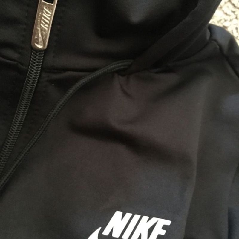 Black nike jacket with best sale white stripe