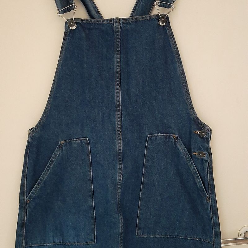 Jardineira jeans saia marisa 2025