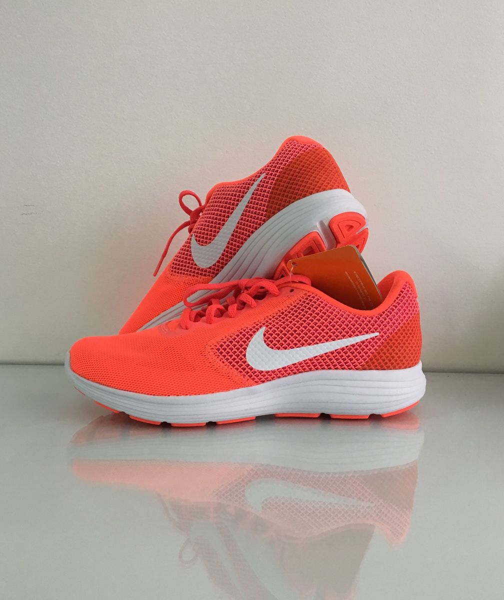 tenis nike laranja fluorescente