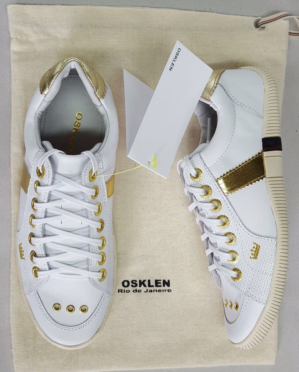 tenis osklen dourado