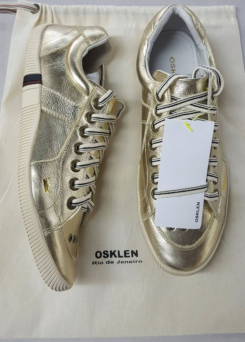 tenis osklen feminino branco e dourado