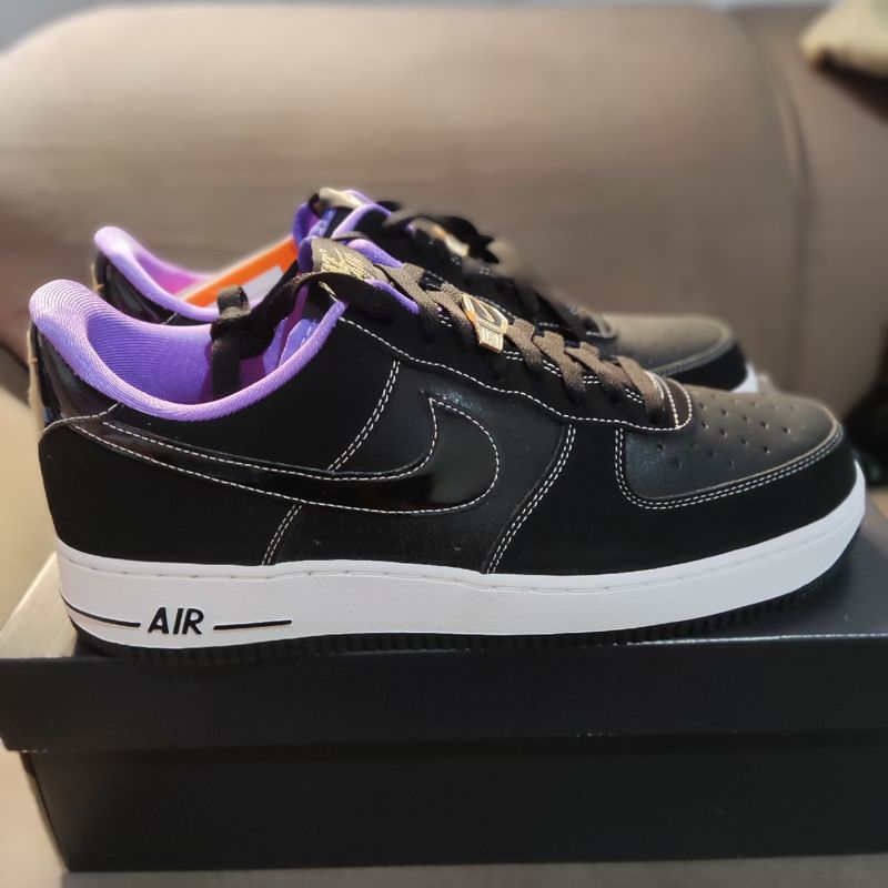 Black nike store with purple swoosh