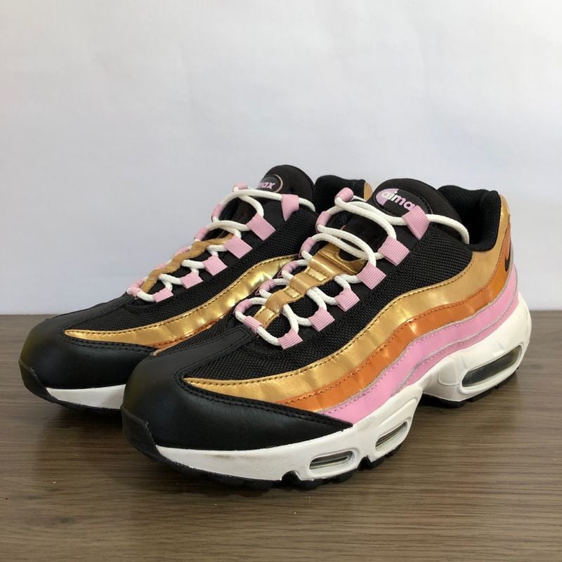 Nike store pink gold