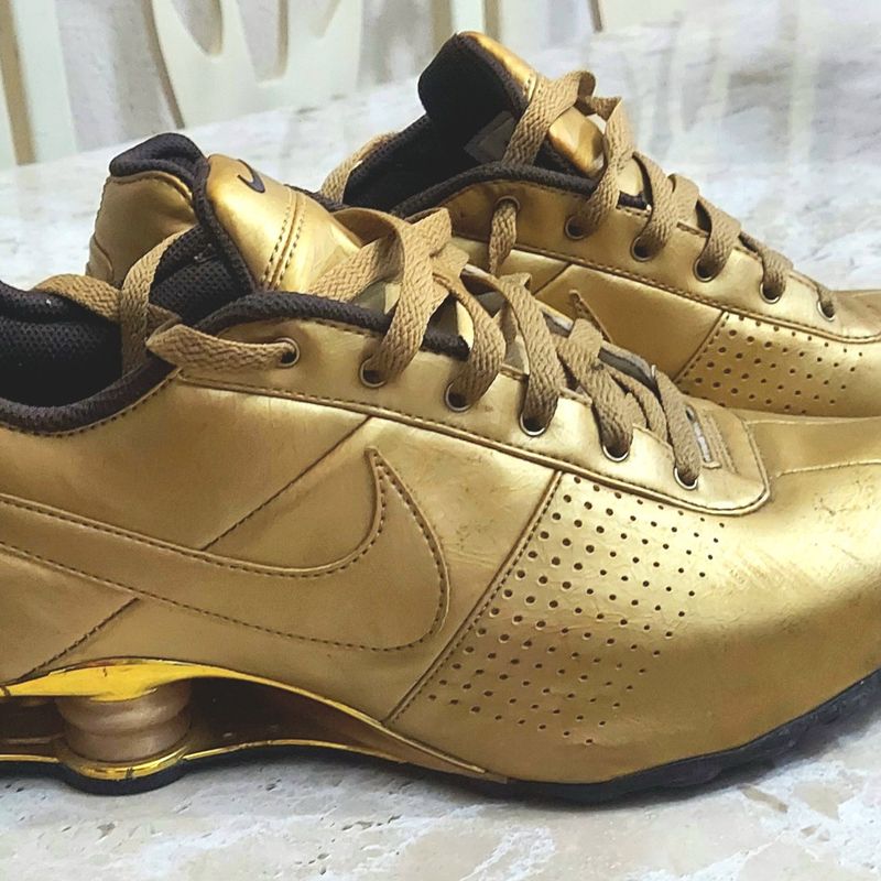 Nike shox clearance dourado original