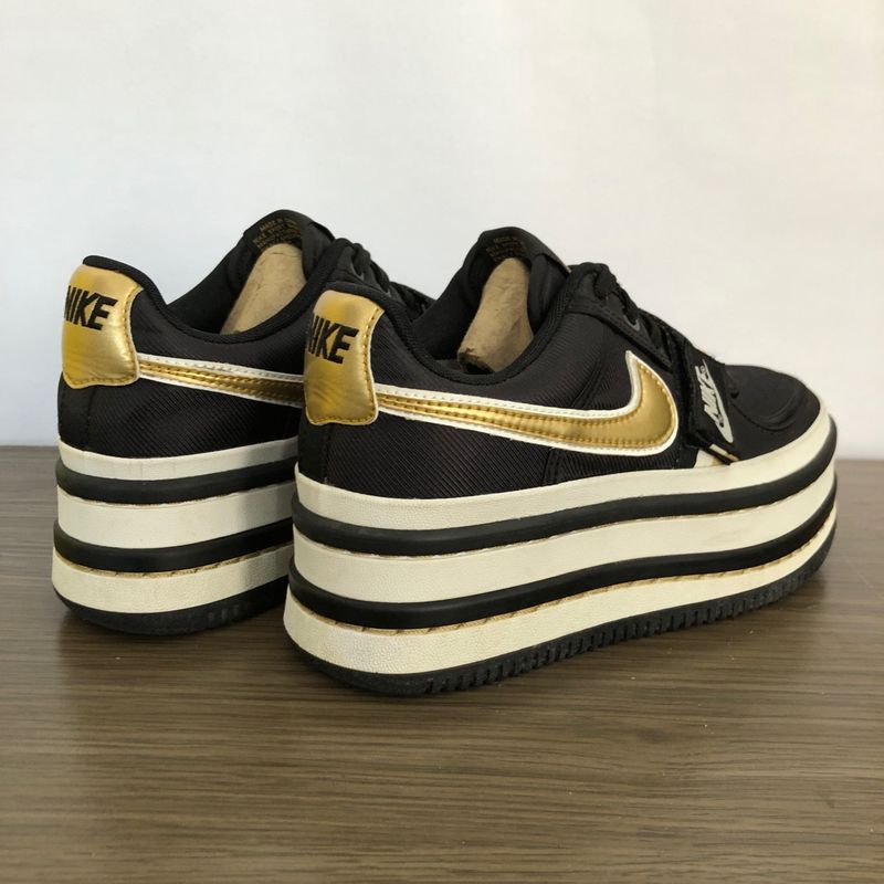 Nike platform sneakers store black and gold