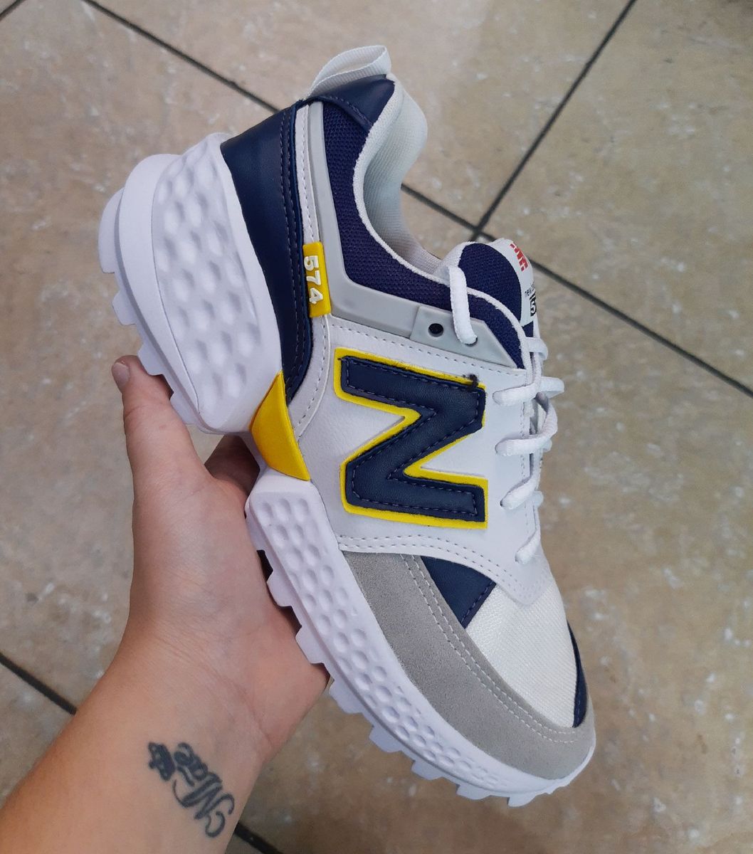 tenis new balance masculino amarelo