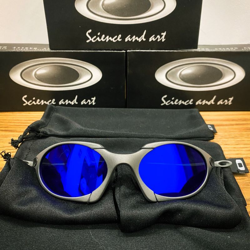 ÓCULOS DE SOL OAKLEY JULIET - LENTE AZUL DARK BLUE ARMAÇÃO CINZA