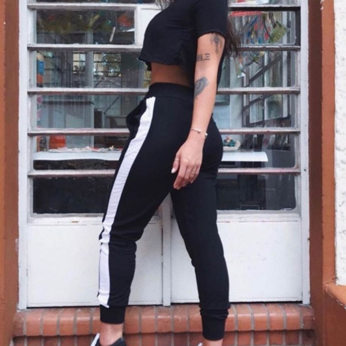 Calça moletom feminina com listra best sale do lado