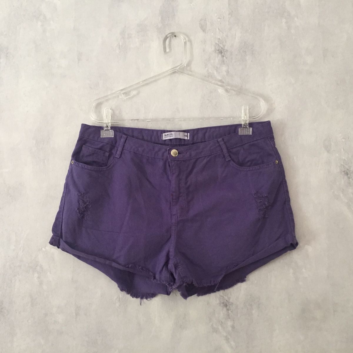 short jeans roxo