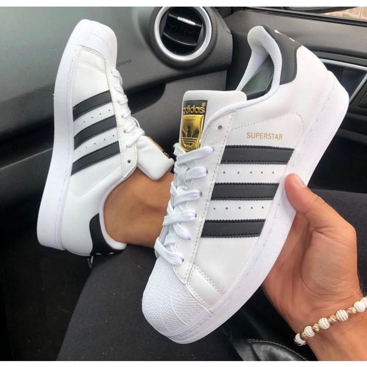 Tenis adidas branco listra 2024 preta