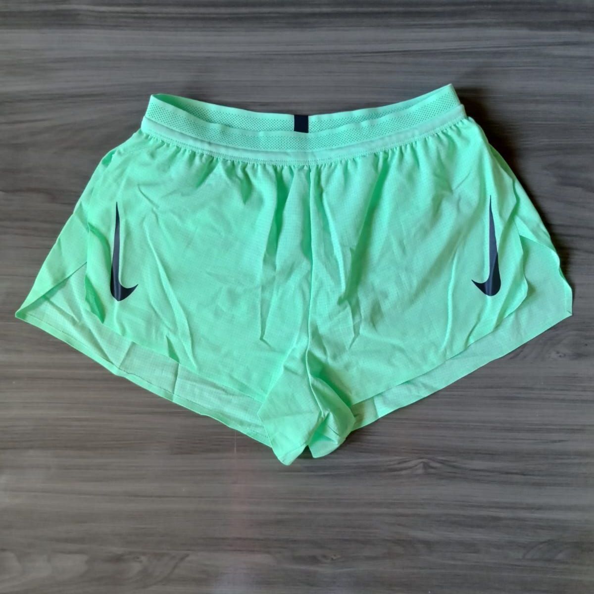 Green nike running store shorts