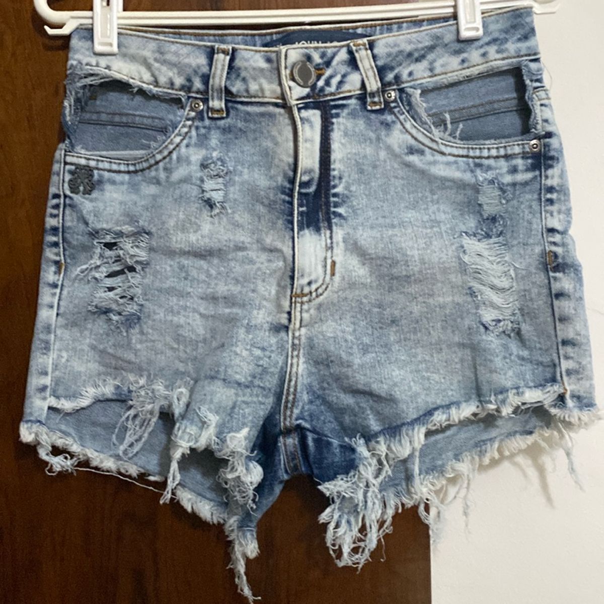 Shorts store bolso vazado