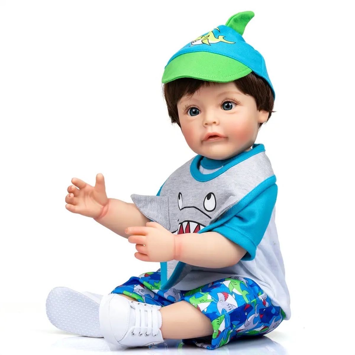 Boneco Bebê Reborn Menino Em Silicone Moreno Olho Azul 55 Cm no