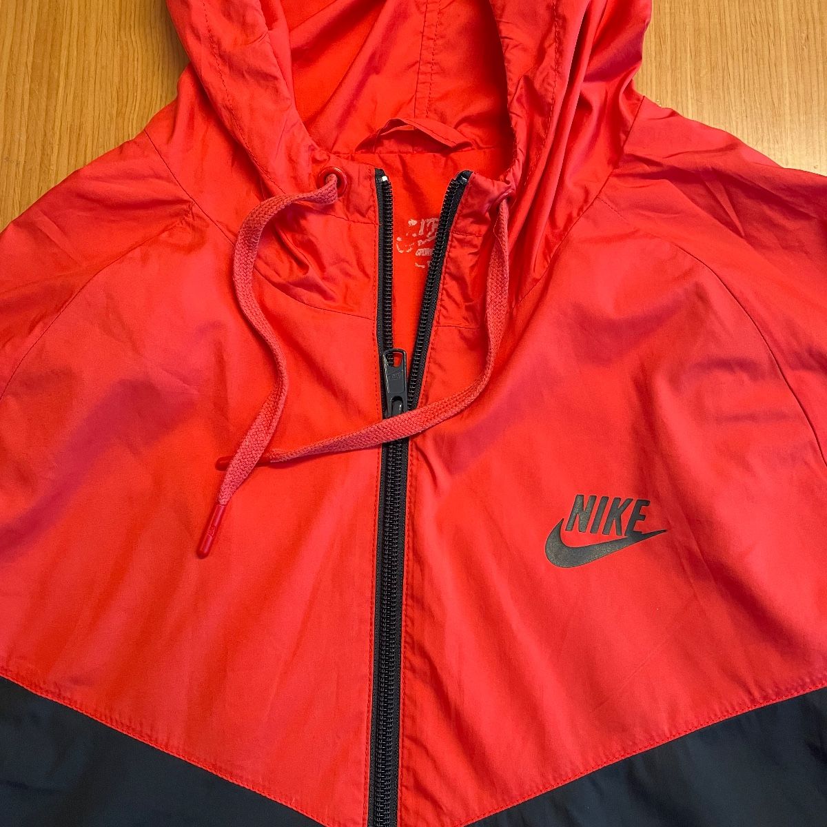 All red nike store windbreaker