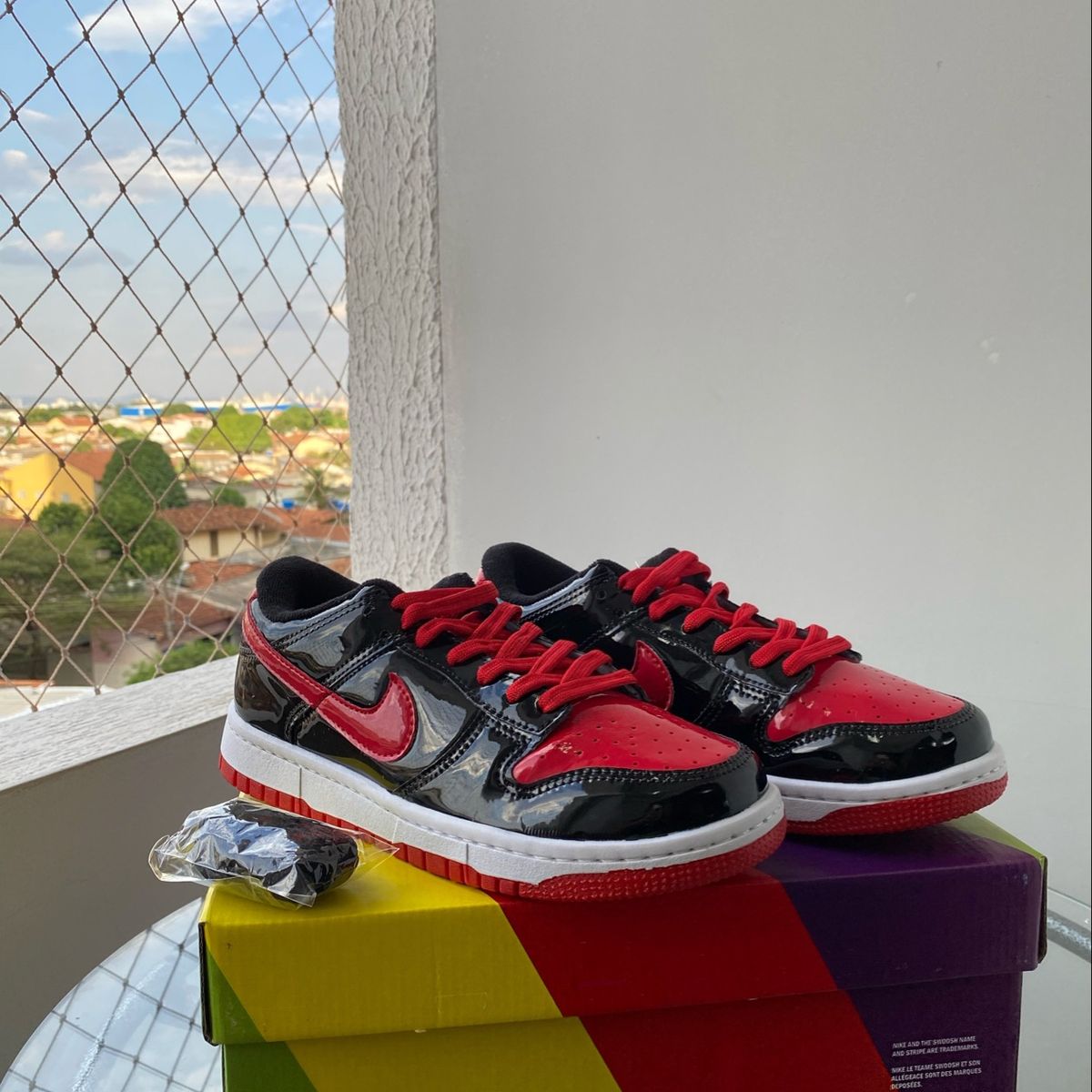 Tenis da nike sales vermelho e preto