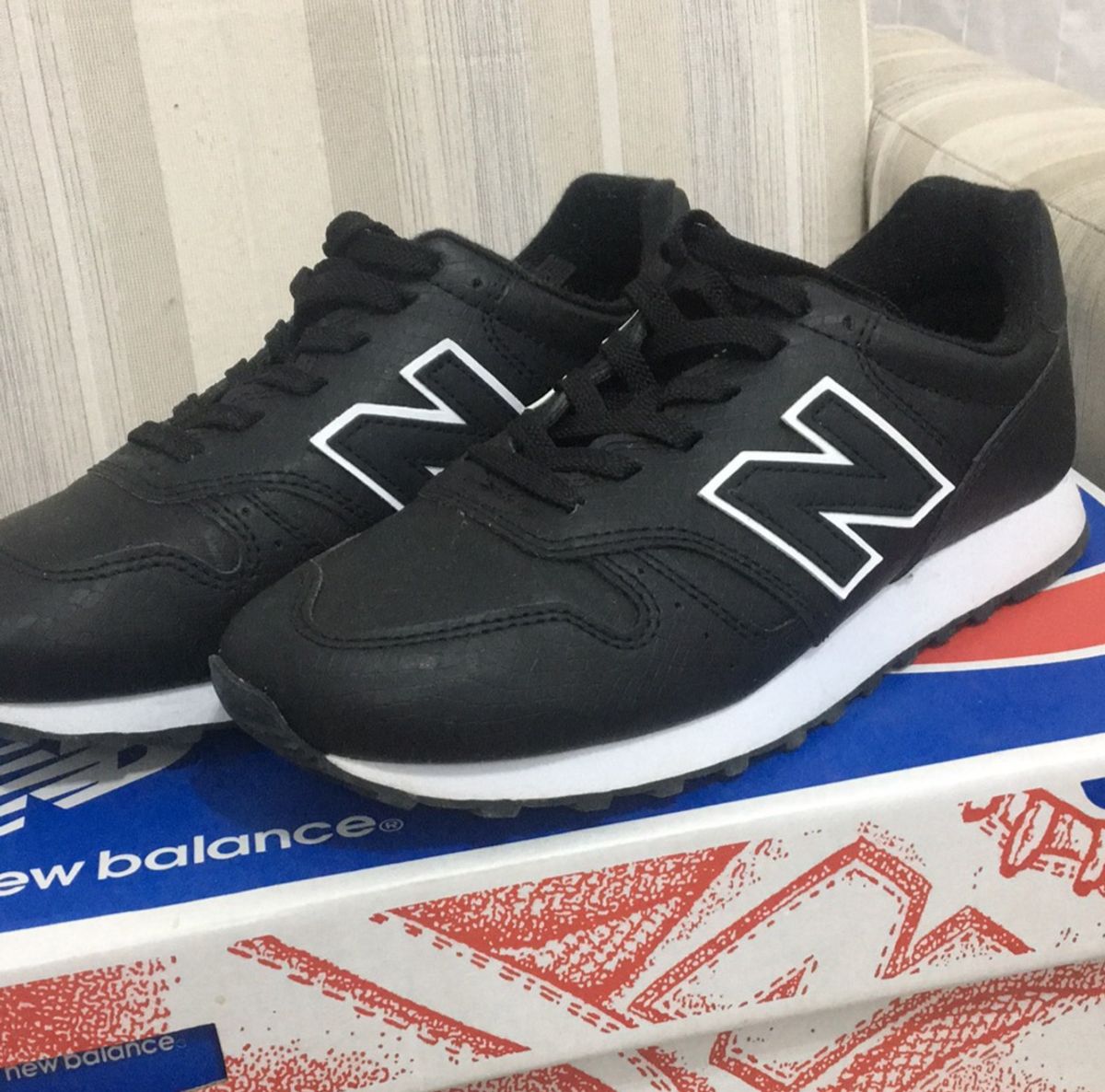 new balance preto couro masculino