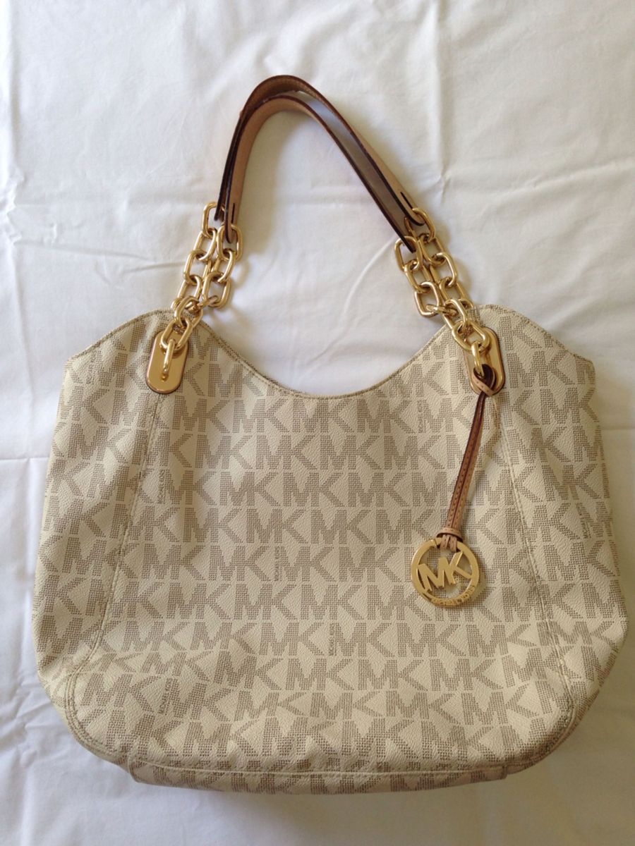bolsa mk dourada