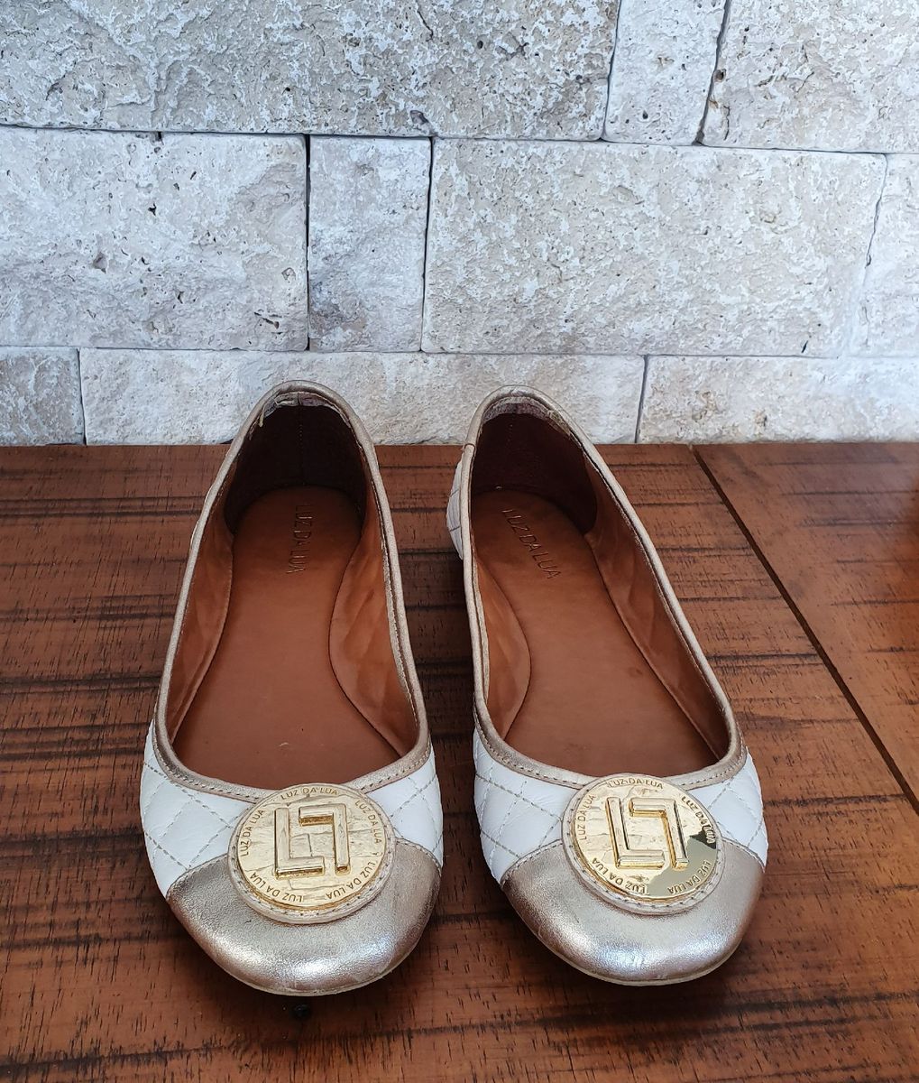 sapatilha dourada luz da lua