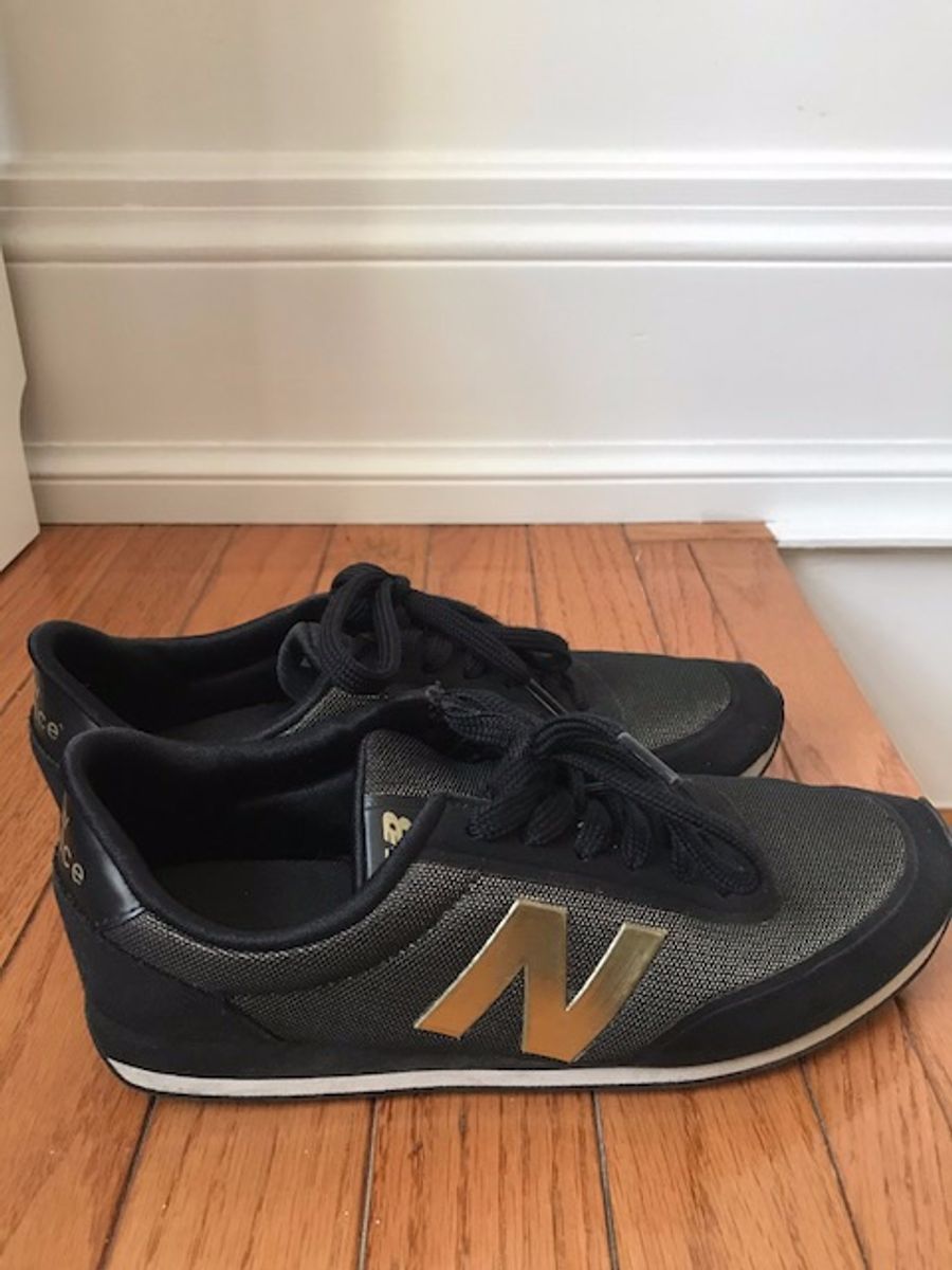 new balance preto com dourado