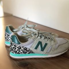 tenis new balance feminino oncinha