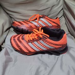 Adidas springblade laranja shop e preto