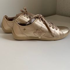 Tenis dourado cravo e hot sale canela