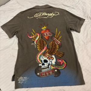 camisa polo ed hardy masculina m 138763319?action_source=72701&ref=home_home&rsp=1&rspix=1