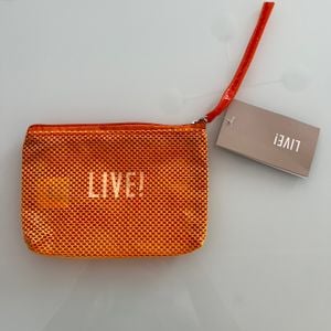 necessaire laranja live nova com etiqueta 143396324?action_source=75018&ref=home_home&rsp=1&rspix=1