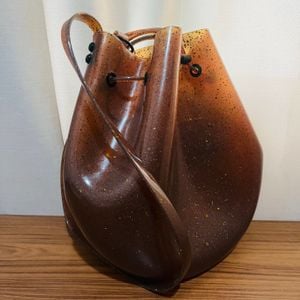 bolsa melissa sac bag conhaque glitter 149621119?action_source=76405&ref=home_home&rsp=1&rspix=1