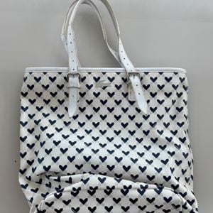 bolsa tote lacoste coracoes 150331117?action_source=76035&ref=home_home&rsp=1&rspix=1