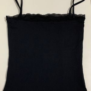 blusa regata izzie decote reto preta m 152749540?action_source=67222&ref=home_home&rsp=1&rspix=1