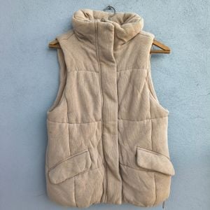 colete puffer feminino gap bege 146693062?action_source=74450&ref=home_home&rsp=1&rspix=1