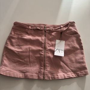 saia jeans rosa 129145897?action_source=68477&ref=home_home&rsp=1&rspix=1