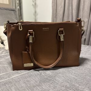 bolsa schutz couro marrom 147060195?action_source=67222&ref=home_home&rsp=1&rspix=1
