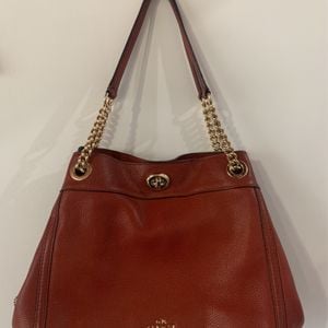 bolsa coach couro marrom 151311492?action_source=72470&ref=home_home&rsp=1&rspix=1