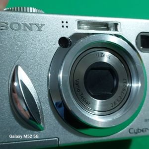 camera fotografica digital sony cybershot 7mp seminova original em aluminio 128832012?action_source=31319&ref=home_home&rsp=1&rspix=1