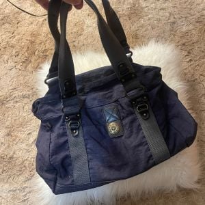 bolsa kipling azul marinho 146170039?action_source=73496&ref=home_home&rsp=1&rspix=1