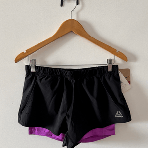shorts reebok 2 in 1 re compressao interna feminino preto corrida treino academia crossfit m 140267312?action_source=75018&ref=home_home&rsp=1&rspix=1