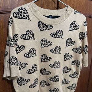 blusa de trico renner estampa coracao bege 141652316?action_source=31319&ref=home_home&rsp=1&rspix=1
