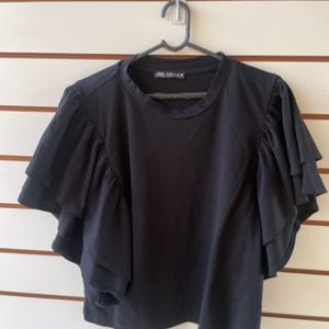 blusa zara preta com babados p 151112224?action_source=76596&ref=home_home&rsp=1&rspix=1