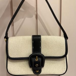 bolsa zara linho bege e preto 151466148?action_source=75772&ref=home_home&rsp=1&rspix=1
